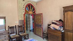 a room with an ornate door in a room at Appement in Agadir nʼ Aït Sa +4 photos