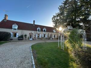 a house with a playground in front of it at Apart'é in Saint-Brisson-sur-Loire