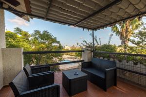 a balcony with two chairs and a table at Casa Sorrapa in Deltebre