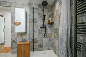a shower with a glass door in a bathroom at Maison du Bonheur, Gîtes in Le Pin +96 photos