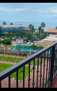 a balcony with a view of a resort at GONIO Mgzavrebi III Apartment 403 in Gonio
