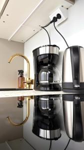 a coffee maker on a counter in a kitchen at City Studio Kalliossa in Helsinki