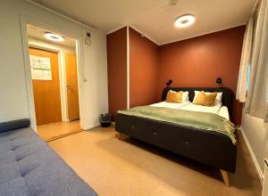 a bedroom with a bed in a room at Nidaros Pilegrimsgård in Trondheim +7 photos