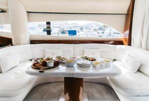 a tray of food on a table on a boat at Only One Yacht Cape Town in Cape Town