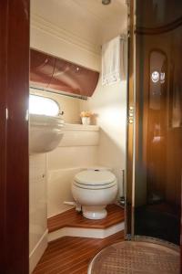 a small bathroom with a toilet and a sink at Only One Yacht Cape Town in Cape Town +36 photos