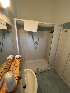 a bathroom with a shower and a toilet and a sink at Hotel Dream in Rimini +30 photos