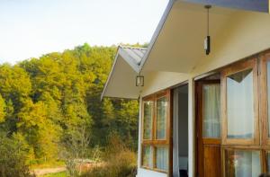 a house with a view of a forest at Isa guesthouse in Shillong