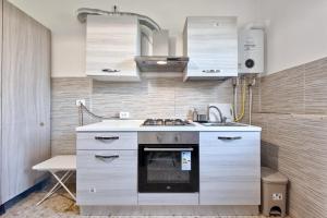 a kitchen with a stove and a sink at Ca Teresa 14 in Marghera