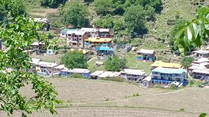an aerial view of a small village with houses at Paris Home Stay in Keran