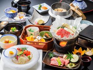 a table topped with plates of food and bowls of food at Mikasa in Nara