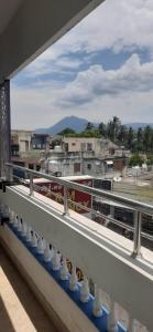 a view of a city from a balcony at SRM Residency in Alāndurai