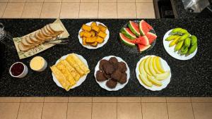 a group of plates of food on a counter at Tetris in Foz do Iguaçu +75 photos