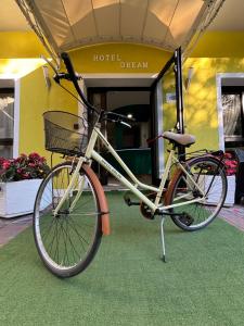 a bike is parked in front of a building at Hotel Dream in Rimini