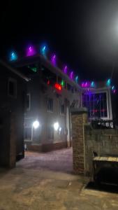 a house with lights on top of it at night at Bright Moon Hotel limited in Enugu