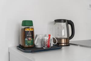 a counter with a jar of food and a blender at Apartment & Rooms - Marina in Ploče