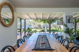 a large dining room with a long table and chairs at Emerald Cove I Private Properties in Denmark +23 photos