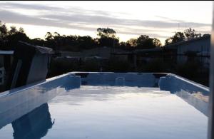 a pool of water in a yard at The Murray River Weekender in Ulupna West
