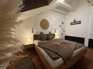a bedroom with a bed with two towels on it at Honor-Penthouse in Linz