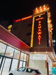 a car parked in front of a hotel restaurant at Hotel Ramawati Near Ganga Ghat, Haridwar in Haridwār