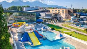 an overhead view of a resort with a water park at Villa Garden Apartments in Poprad