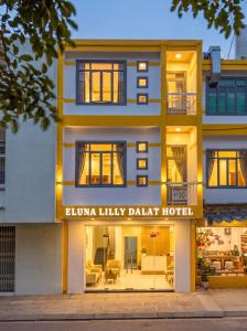a building with a sign that reads elzu luxury dahab hotel at Eluna Lilly Da Lat Hotel in Da Lat