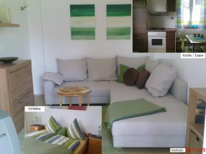 a living room with a couch and a kitchen at Haus Schnitzler in Wasserburg