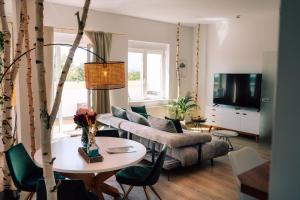 a living room with a couch and a table at The Blasky in Frankfurt