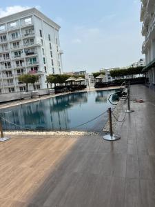a large swimming pool in the middle of a building at The Comfort stays gomti nagar in Lucknow