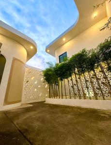 a fence in front of a house at TAP Salaya in Salaya