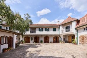 an exterior view of a house with a driveway at Apartment im Schlössl in Leibnitz +17 photos