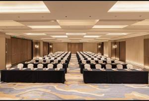 a large room with rows of chairs in it at Howard Johnson Jinyi Hotel Chongqing in Chongqing