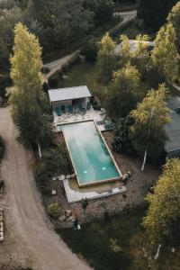 an overhead view of a swimming pool in a yard at Lodge 3 - LE JOLIS CHALETS in Barbey-Séroux