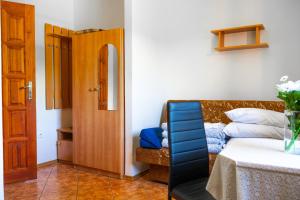 a living room with a couch and a table at Helena in Karwia