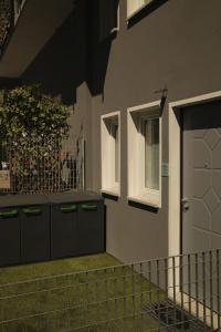 a house with a white door and a window at Monica's Loft in Domodossola