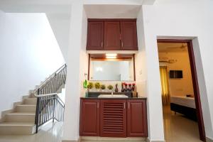 a bathroom with a sink and a staircase at Palm Beach View Resort Cherai in Cherai Beach