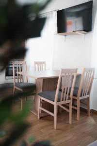 a dining room table with two chairs and a table and chairsktop at EUCALYPTUS in Nerezine