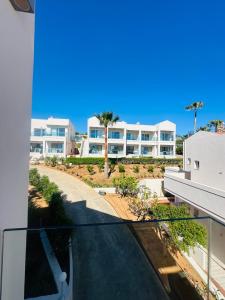 a view of a building from the balcony of a house at Saradari Beach Hotel - Adults Only in Hersonissos