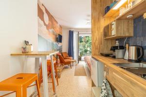 a kitchen with a sink and a counter top at Studio La Provençale in Avignon
