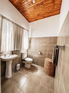 a bathroom with a toilet and a sink at Lekkerbly Self Catering in Pofadder +51 photos
