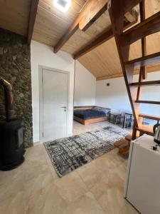 a large room with a bed and a door at Privat-Villa-Котедж in Mykulychyn