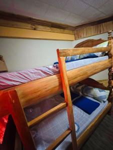 a couple of bunk beds in a room at Sagada Pinewood Lodge basement in Sagada
