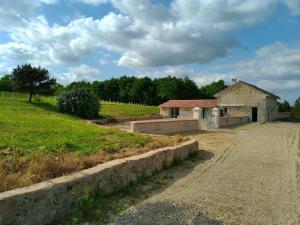 an old building on the side of a road at Seul au Monde in Guizengeard