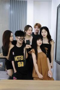 a group of young people posing for a picture at Lamer Hostel in Cat Ba