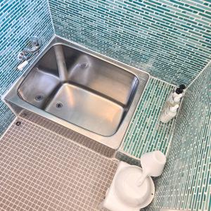 a bathroom with a sink and a toilet at Snow Veil Iwamizawa in Iwamizawa