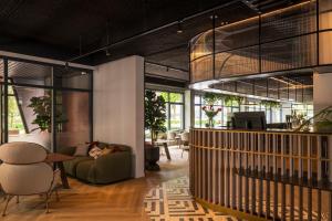 a living room with a couch and a table at TULIP Hotels & Residences - Zwolle in Zwolle +38 photos