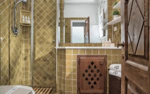 a bathroom with a shower and a toilet and a sink at Amazing Two-Bedroom House with Sea View in Cala di Volpe in Porto Cervo