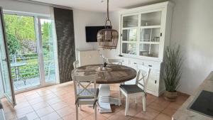 a dining room with a table and chairs at Haus Katharina, Balkon mit Meerblick in Lauterbach