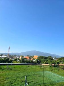a view of a field with a tennis court at Blue Sky Private Pool Villa in Chiang Mai