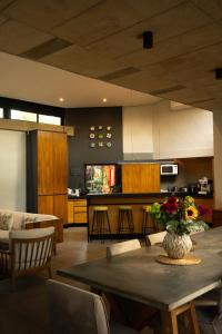 a living room with a table with a vase of flowers at Bastion House in Irene