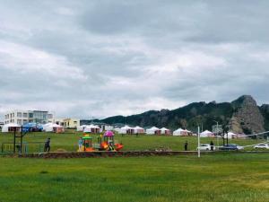 a park with a playground with a play equipment at Terelj Khangai Resort in Belen Hüryee Hiid